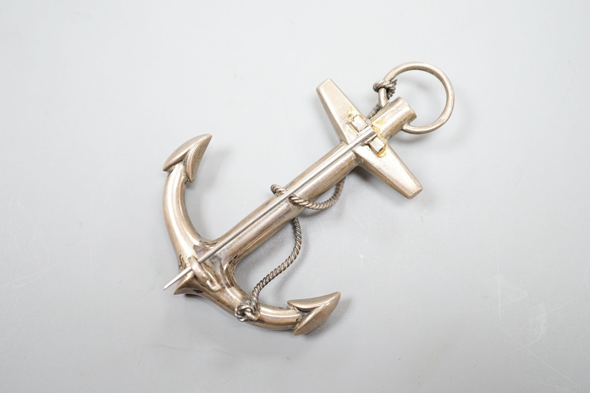 An early 20th century white metal and Scottish hardstone set anchor brooch, 73mm.